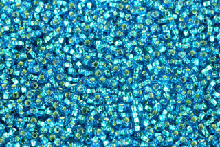 PRECIOSA rokajl 8/0 (2,8 - 3,2 mm) SH, bal. 50 g - transp. akvamarínově modrá, SL
