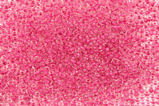 PRECIOSA rokajl 11/0 (2,0 - 2,2 mm) RH, bal. 50 g - krystal, tmavší růžový průtah