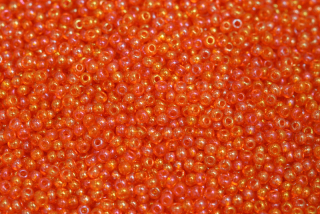 PRECIOSA rokajl 10/0 (2,2 - 2,4 mm) RH, bal. 50 g - transp. oranžová hyacint, rainbow