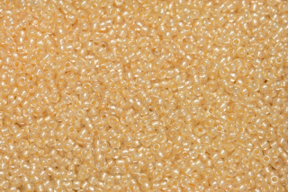 PRECIOSA rokajl 11/0 (2,0 - 2,2 mm) RH, bal. 50 g - krystal, žlutý perleťový průtah, sfinx