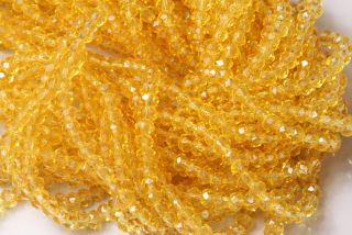 Broušené korálky slavík 3x2 mm, cca 145 ks na šňůře 36 cm - transp. topazově žlutá
