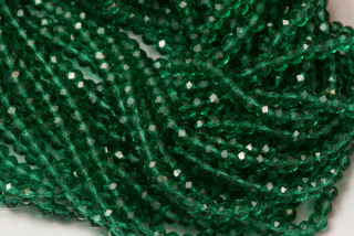 Broušené korálky slavík 3x2 mm, cca 145 ks na šňůře 36 cm - transp. smaragdově zelená