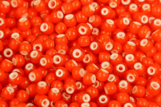 PRECIOSA Kornelián 6/0 (3,7 - 4,3 mm), bal. 50 g - transp. oranžová, bílý střed