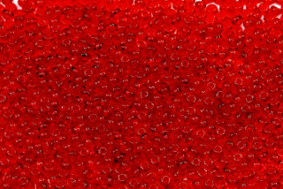 PRECIOSA rokajl 10/0 (2,2 - 2,4 mm) RH, bal. 50 g - transparentní rubínově červená