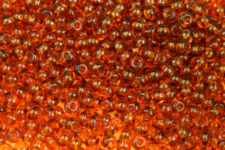 PRECIOSA rokajl 6/0 (3,7 - 4,3 mm) RH, bal. 50 g - transparentní topaz, hnědá