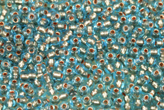 PRECIOSA rokajl 6/0 (3,7 - 4,3 mm) RH, bal. 50 g - transp. akvamarín, bronzový vtah