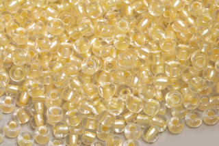 PRECIOSA rokajl 6/0 (3,7 - 4,3 mm) RH, bal. 50 g - krystal, metalický žlutý vtah