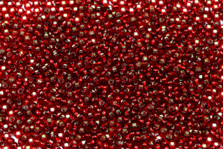 PRECIOSA rokajl 9/0 (2,4 - 2,8 mm) RH, bal. 50 g - transp. rubínově červená, SL