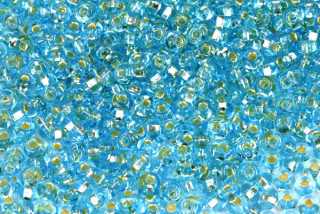PRECIOSA rokajl 6/0 (3,7 - 4,3 mm) RH, bal. 50 g - transp. akvamarínově modrá, SL