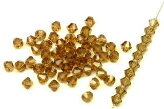 M.C. sluníčka (bicone) 4 mm, 36 ks - transp. kouřový topaz, smoke topaz